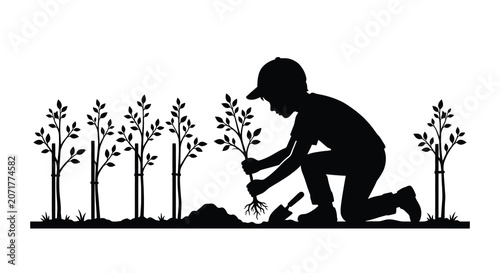 Tableau sur toile Gardener planting a small tree amidst foliage depicted as a black silhouette hor