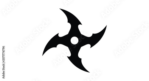 Photography Four pointed throwing star with central opening a black silhouette against a whi