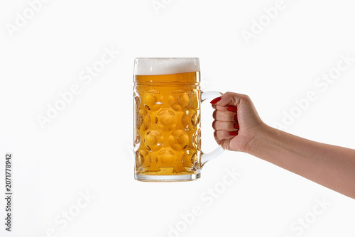 Konstfotografi Female hand holding large foamy beer mug on white background