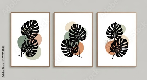 Three framed artworks featuring abstract floral designs with black and white patterns.