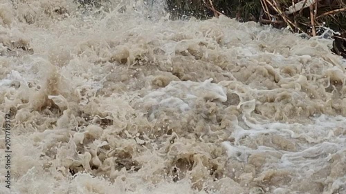 Powerful river current after seasonal rainfall