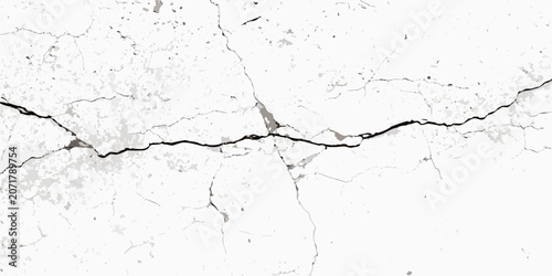 Foto Cracked wall texture with irregular fissures a black and white distressed surfac