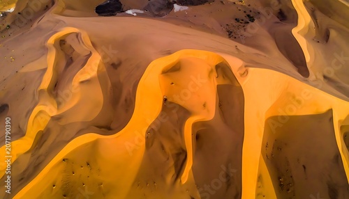 Aerial view of desert sand dunes landscape.