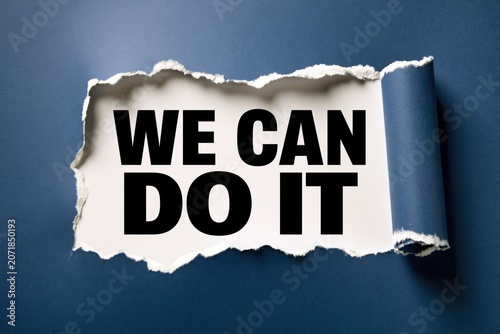 We can do it phrase appearing behind ripped blue paper background