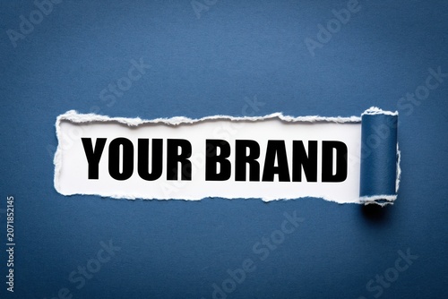 Your brand concept written under torn blue paper