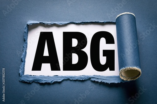 ABG concept written under torn blue paper