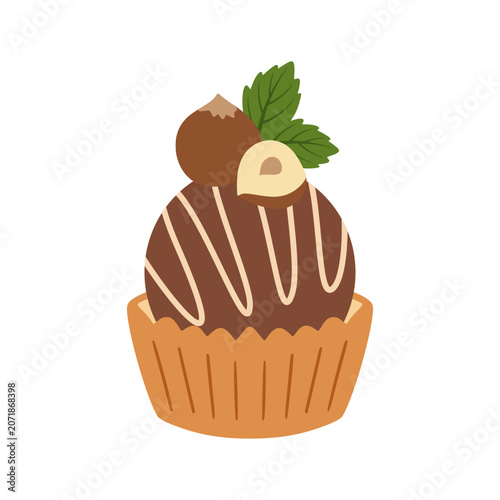 Chocolate truffle dessert with hazelnuts and mint leaves