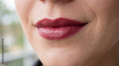 The lipstick has a rich color but feels lightweight and comfortable. It's easy to apply, with a soft, smooth texture that glides effortlessly onto the lips, Close up lips
