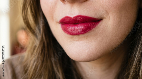 The lipstick has a rich color but feels lightweight and comfortable. It's easy to apply, with a soft, smooth texture that glides effortlessly onto the lips, Close up lips