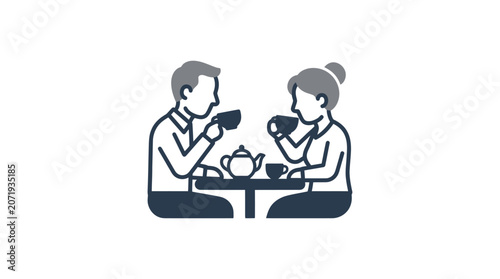 Fotografie Couple sitting at table eating.
