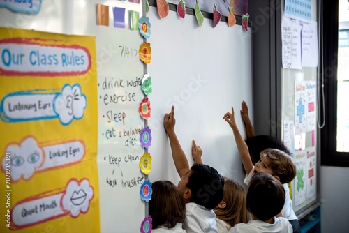 Bild auf Leinwand Children engaged in classroom activities.