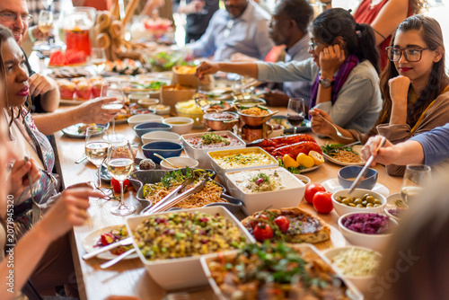 Obraz na plátne Diverse group enjoying communal feast