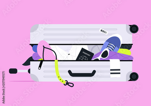 Fotografi Open suitcase overloaded with clothes and personal belongings, baggage excess