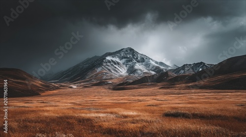 Majestic Mountain Peaks Above Vast Tundra Landscape