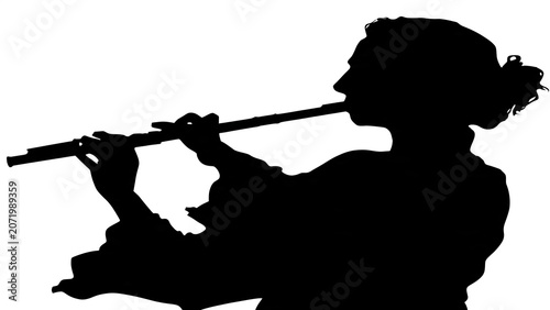 Silhouette of a person with raised arms against sky.