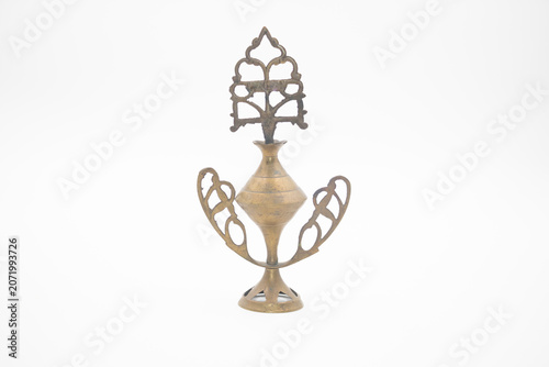 a kohl container or kohl vial . It is a traditional, small decorative box or vial used to store and apply surma.