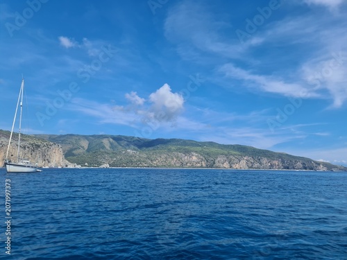Vessel at a bay, enjoying the scenic views of the coastline