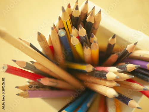 Macro Close-Up of Pencil Tips and Bottoms in White Cup Wooden Table Artist Studio