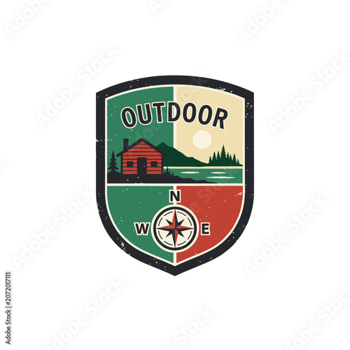 Shield shaped outdoor cabin and compass logo.