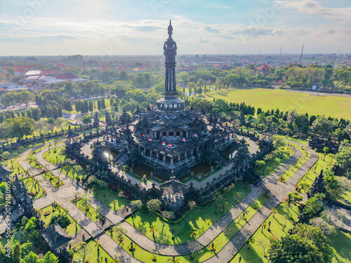 Εκτύπωση καμβά The elaborate multi-level architecture of Bajra Sandhi dominates its surrounding parkland from above, its dark volcanic stone contrasting sharply with the vivid green grass below