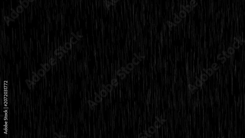 Heavy rain looping over black background.Falling raindrops footage animation in slow motion on black background.4K loopable high-speed footage.