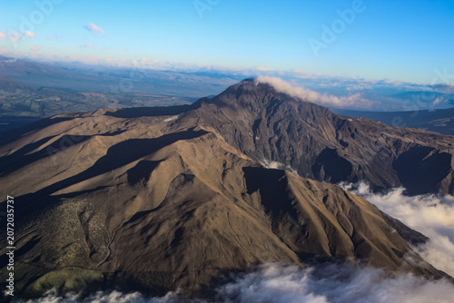 The beautiful rugged Andes mountain range and peaks under a blue sky near Quito, Ecuador.