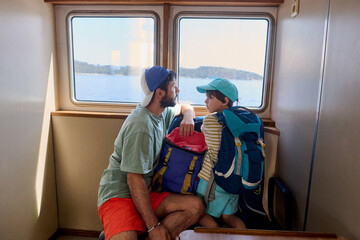 Father and child traveling by ferry