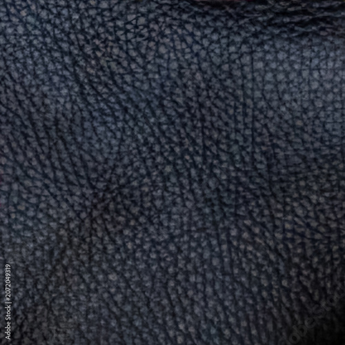 Macro photography of black matte genuine leather texture with natural grain, square crop