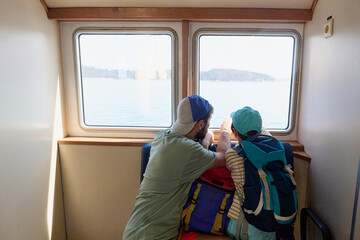 Father and child traveling by ferry