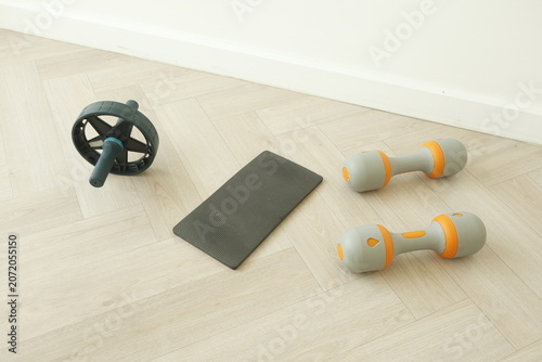 Core training gear meticulously arranged within minimalist studio space