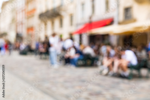 Blurred old city street backgrounds of Lviv out of focus bokeh with people and cafes
