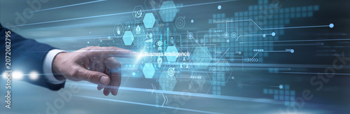 Fotografie Data scientist expertly touching smart monitor extracting Business Intelligence insights via the enterprise network portal