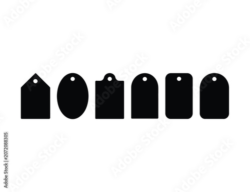 Photos A collection of six black silhouette gift tags with various shapes and hole punc