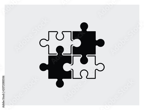 Four interlocking jigsaw puzzle pieces in black and white representing problem solving and teamwork concepts