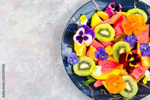 Fresh Summer Fruit Salad with Edible Flowers and Tropical F