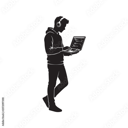 Silhouette of a coder with headphones using laptop