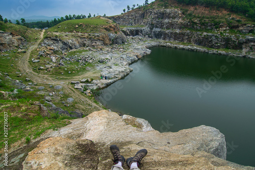 Top view of Tarpania Lake, Marble Lake, Blue Dam, Patal Dam or Durga Bera,a scenic lake in the Ajodhya Hills of Purulia, West Bengal, India. Water surrounded by sharp, white, marble-like rocky cliffs.