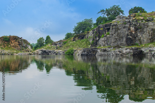 Tarpania Lake, Marble Lake, Blue Dam, Patal Dam or Durga Bera,a scenic lake in the Ajodhya Hills of Purulia, West Bengal, India. Deep blue water surrounded by sharp, white, marble-like rocky cliffs.