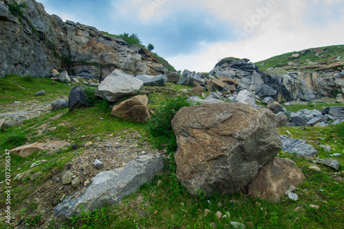 Rocks and stones of Tarpania Lake, Marble Lake, Blue Dam, Patal Dam or Durga Bera,a scenic lake in the Ajodhya Hills of Purulia, West Bengal, India. Blue water surrounded by marble-like rocky cliffs.