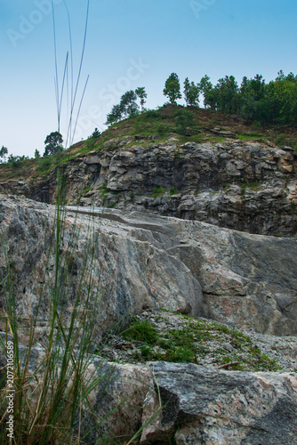 Rocks and stones of Tarpania Lake, Marble Lake, Blue Dam, Patal Dam or Durga Bera,a scenic lake in the Ajodhya Hills of Purulia, West Bengal, India. Blue water surrounded by marble-like rocky cliffs.
