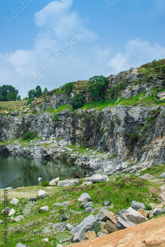 Sharp, white, marble-like rocky cliffs of Tarpania Lake, Marble Lake, Blue Dam, Patal Dam or Durga Bera,a scenic lake in the Ajodhya Hills of Purulia, West Bengal, India. Lake has Deep blue water.
