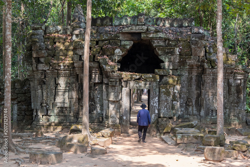Man entering the Ta Som temple in Cambodia