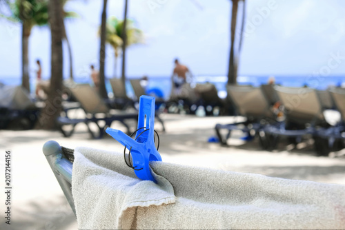 Beach scene with a towel and clothespin.