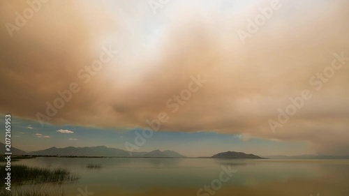 Timelapse of wildfire smoke moving over Utah Lake as fire burns around Eureka, Utah.
