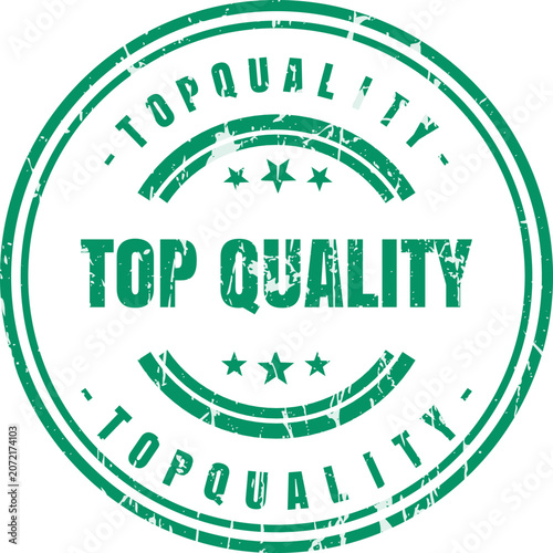 A circular green ink stamp featuring the words top quality surrounded by a decorative border