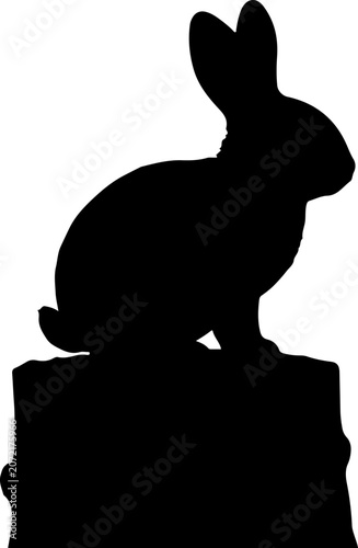 Silhouette of a Cute Rabbit Sitting on a Tree Stump Isolated on a White Background Graphic Design