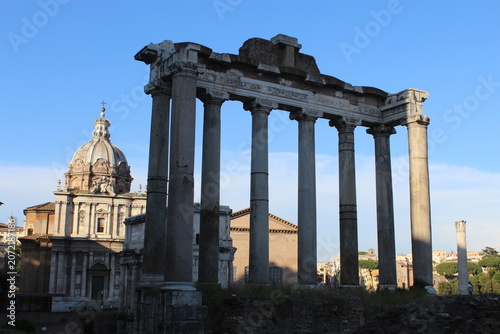 ROME, ITALY - JUNE 5, 2016: Roman Forum archaeological area with historic ruins and blue sky