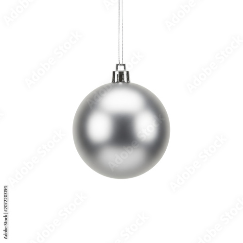 Single spherical matte silver christmas ornament with a metallic surface suspended by a thin thread against a transparent studio background, elegant holiday atmosphere