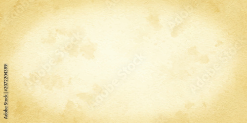 Fotografie An abstract watercolor wash in pale yellow and cream tones creates a soft, ethereal background texture, evoking a sense of vintage parchment or delicate cloud formations
