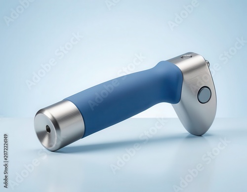 Modern blue and silver handheld electronic medical tool lying flat on a light blue background.